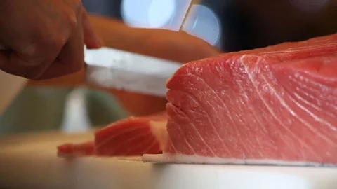 Sushi chef slice raw fish meat Stock Footage 77607306