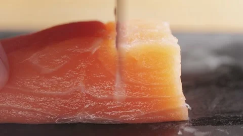 Sushi Chef Slices fresh Raw Salmon on professional kitchen, close up. Chef Stock Footage 238849708