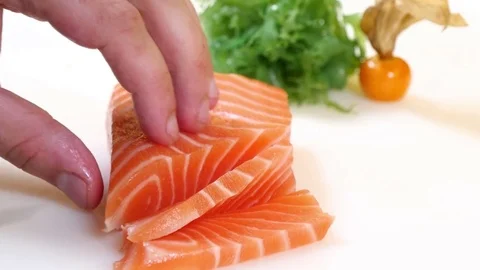 Sushi Chef Slices a Salmon Steak Nigiri Style Stock Footage 80557262