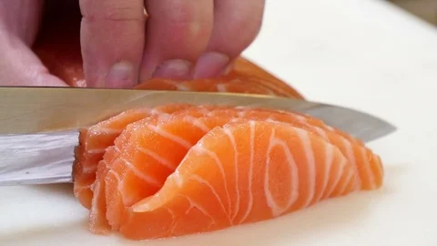 Sushi Chef Slicing a Salmon Steak Nigiri Style Stock Footage 80557205