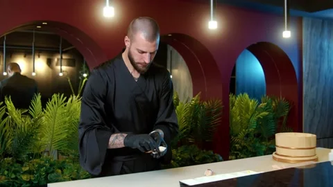 Sushi chef taking wasabi and rice and making a ball in hands Stock Footage 239096315
