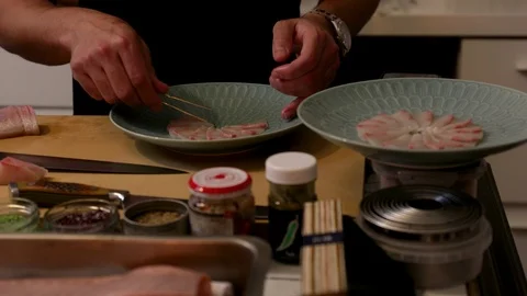 Sushi chef's hands at work Stock Footage 105583600