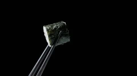 Sushi in chopsticks Stock Footage 10855726