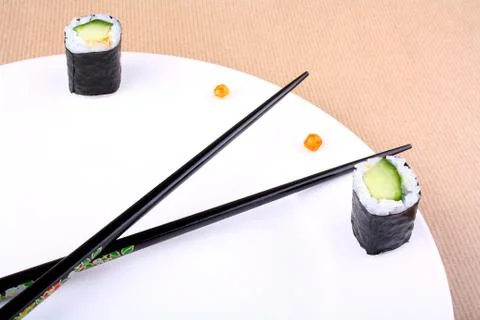Sushi clock, time concept with caviar on white plate Stock Photos