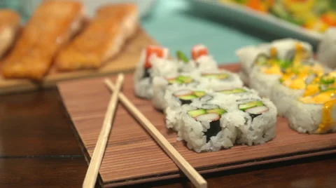 Sushi Close Up Move Right on a Table Spread Stock Footage 64974201