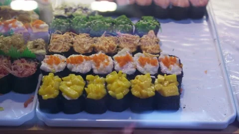 Sushi of different flavors are placed together Stock Footage 322779890