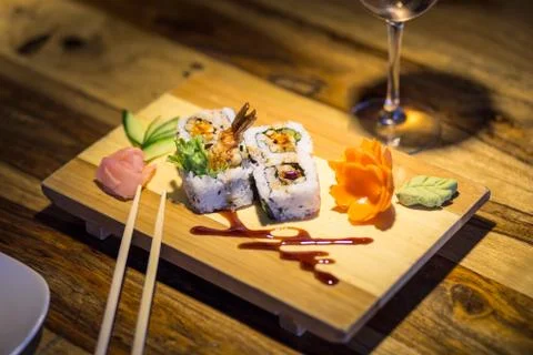Sushi in Dimly Lit Setting Foto stock