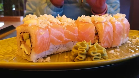 Sushi eats a girl in a restaurant Stock Footage 87795326