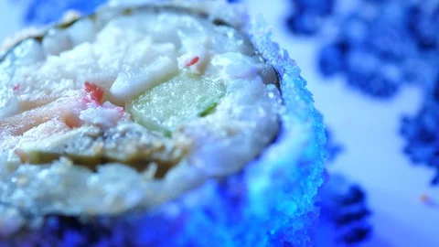 Sushi Macro roll no stick. Uramaki Japanese Rice Salmon Vasabi Tuna soy close-up Stock Footage 128976164