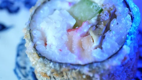 Sushi Macro roll no stick. Uramaki Japanese Rice Salmon Vasabi Tuna soy close-up Stock Footage 128976331