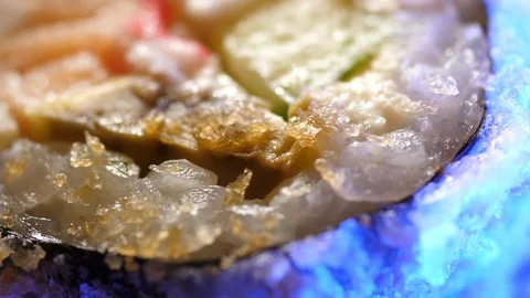 Sushi Macro roll no stick. Uramaki Japanese Rice Salmon Vasabi Tuna soy close-up Stock Footage 128976572