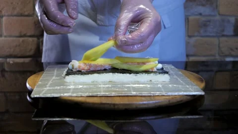Sushi maki, rice rolls preparing process. Japanese food concept Stock Footage 132004866
