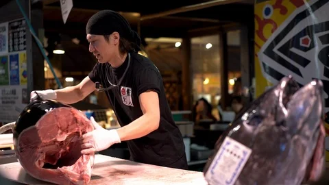 Sushi master is demonstrating during tuna cutting session at Marina City Stock Footage 99629946