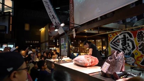 Sushi master is demonstrating during tuna cutting session at Marina City Stock Footage 99630886