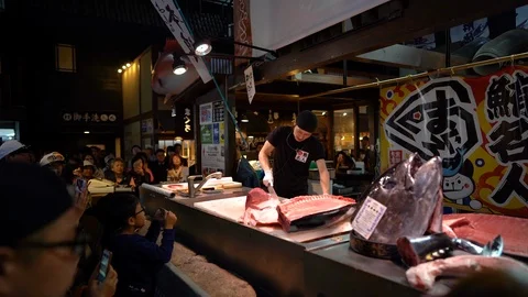Sushi master is demonstrating during tuna cutting session at Marina City Stock Footage 99631870