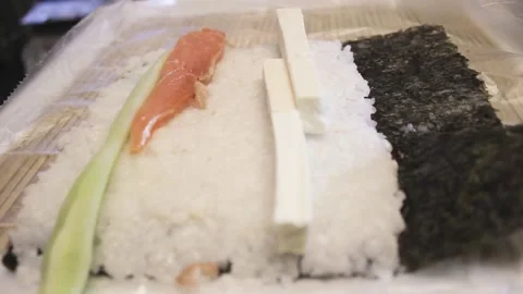 Sushi master makes the roll in the restaurant, and street food Video stock 130563979