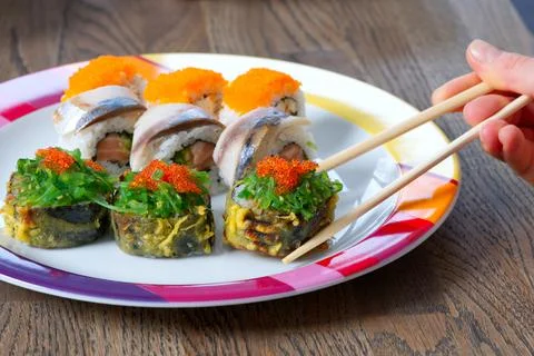 Sushi mixed set with different fish, seaweed and caviar. Restaurant home food Stock Photos