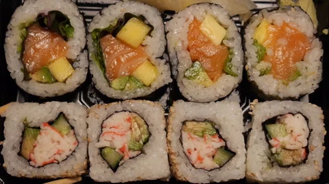 Sushi picked up of tray in real time Stock Footage 61919216