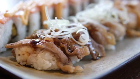 Sushi with pork with beef fried meat with salmon grilled red fish salmon asian Stock Footage 309529761
