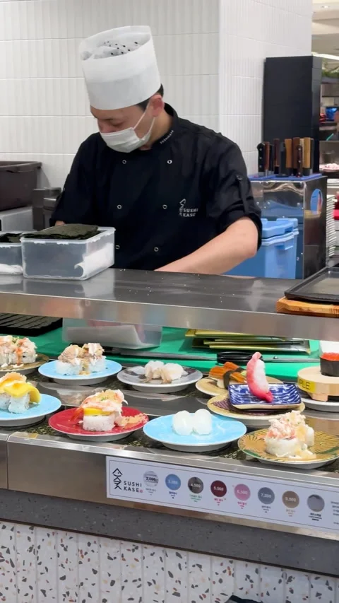 Sushi restaurant with an array of colorful sushi and delicacies on display Stock Footage 315673623