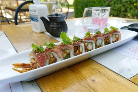 Sushi restaurant. Outside table set up and dish presentation. Raw salmon sushi Stock Photos