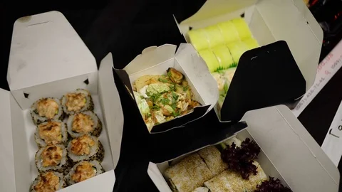 Sushi roll close-up in a box, slow mo wasabi and soy sauce, delicious food deliv Stock Footage 127520519