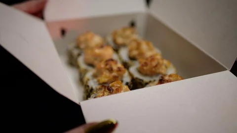 Sushi roll close-up in a box, slow mo wasabi and soy sauce, delicious food deliv Stock Footage 127520527