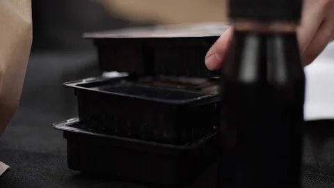 Sushi roll close-up in a box, slow mo wasabi and soy sauce, delicious food deliv Stock Footage 127521534
