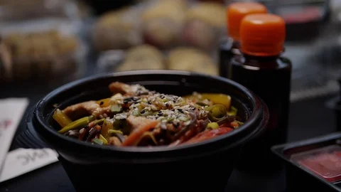 Sushi roll close-up in a box, slow mo wasabi and soy sauce, delicious food deliv Stock Footage 127541655