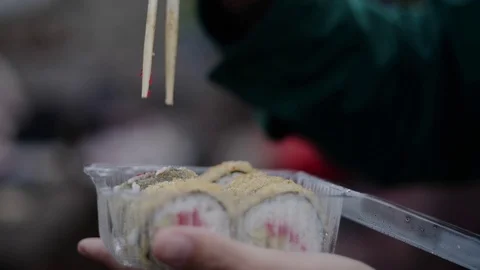 Sushi roll close-up in a box, slow mo wasabi and soy sauce, delicious food deliv Stock Footage 127541681