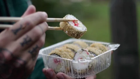 Sushi roll close-up in a box, slow mo wasabi and soy sauce, delicious food deliv Stock Footage 127541684