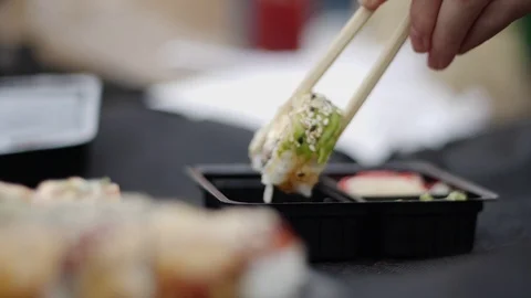 Sushi roll close-up in a box, slow mo wasabi and soy sauce, delicious food deliv Stock Footage 127541838