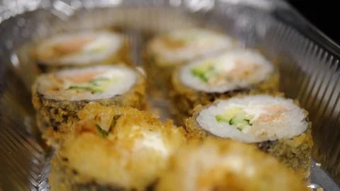 Sushi roll close-up in a box, slow mo wasabi and soy sauce, delicious food deliv Stock Footage 127541930