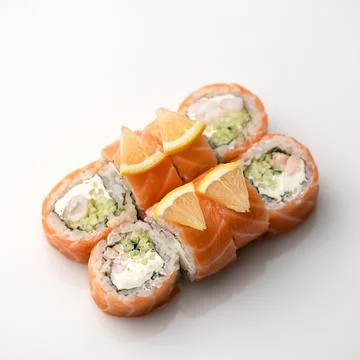 Sushi roll decorated with lemon. Inside-out Sushi Set. Traditional Japanese food Stock Photos