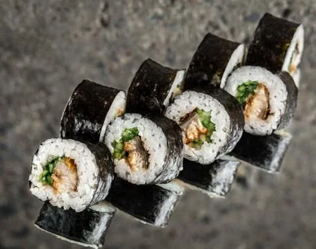 Sushi roll with eel and cucumber Stock Photos