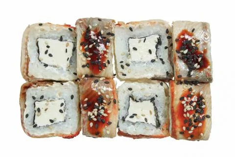 Sushi roll with eel, cheese and sesame. Stock Photos