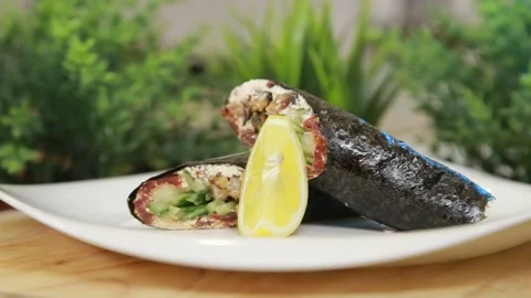 Sushi roll with fresh vegetables and mussels on a plate Stock Footage 340551437