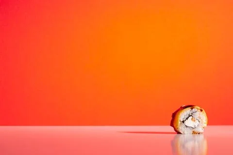 Sushi roll isolated on the red background Stock Photos