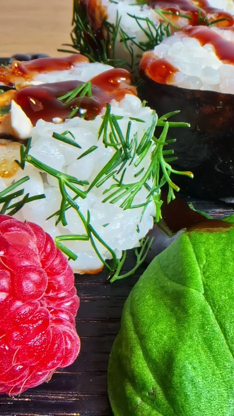 Sushi Roll with Salmon Roe Dill Teriyaki Sauce and Raspberry Picked by 库存影片 339078483