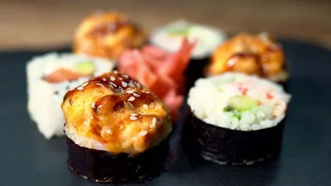 Sushi roll set on the black plate. Japanese food. Stock Footage 134042028