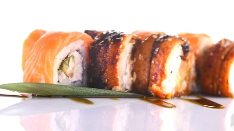 Sushi roll set on white background. Rotated rolls with salmon, tuna, eel 動画素材 88190138