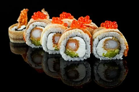 Sushi roll with shrimp, cream cheese, eel and cucumber Stock Photos