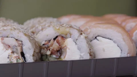 Sushi Roll Turned on a Green Background. Stock Footage 167326338