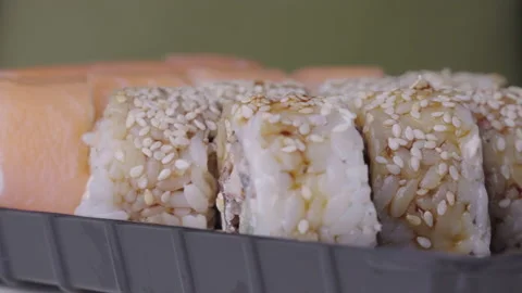 Sushi Roll Turned on a Green Background. Stock Footage 169527940