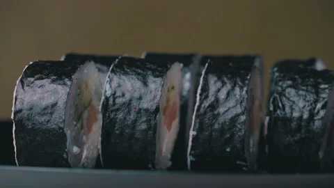 Sushi Roll Turned on a Green Background. Stock Footage 170665199