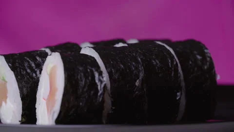 Sushi Roll Turned on a Pink Background Stock Footage 169709590