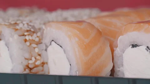 Sushi Roll Turned on a Red Background. Stock Footage 169709841