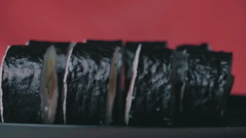 Sushi Roll Turned on a Red Background. Stock Footage 170667951