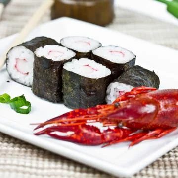 Sushi rolls and crayfish Stock Photos