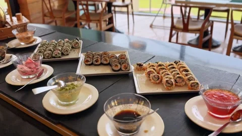 Sushi rolls and sauces on restaurant buffet table Stock Footage 336643786